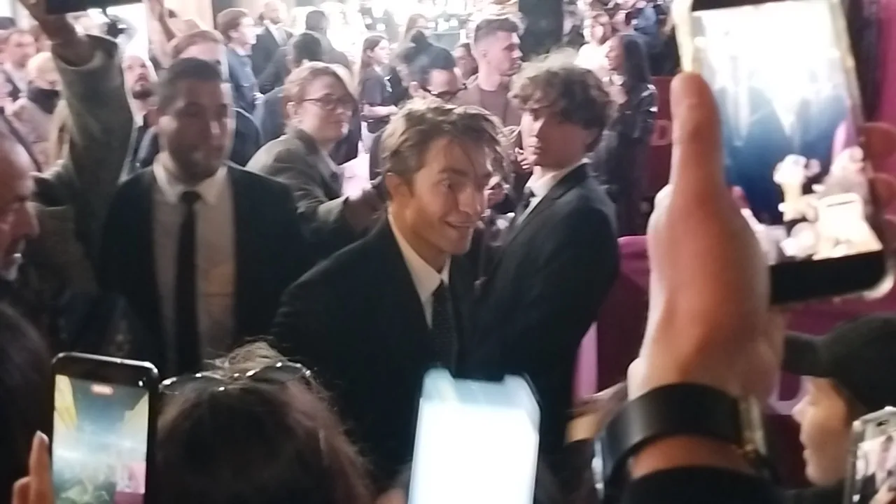 Robert Pattinson greeting fans at The Drama premiere in March 2026