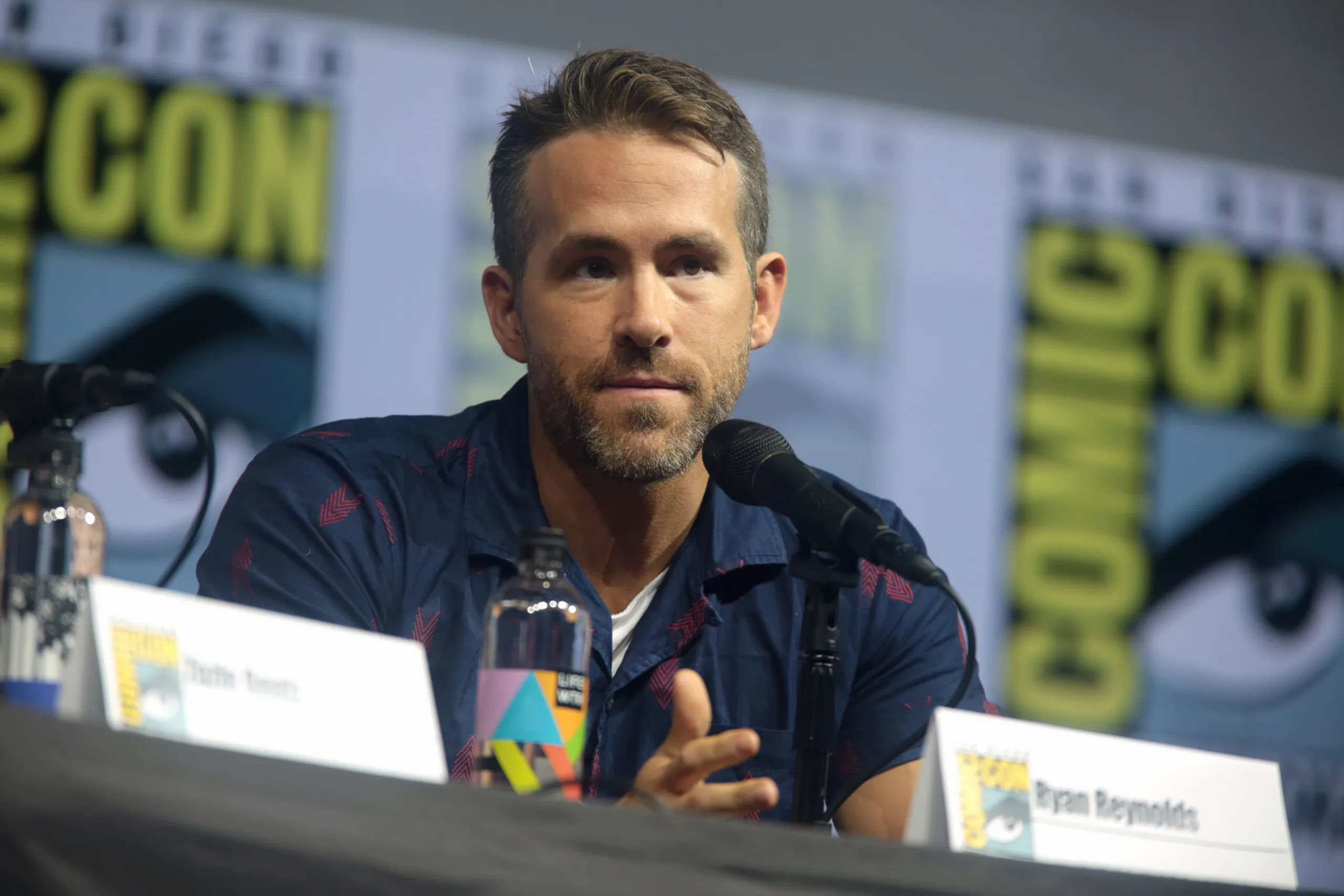 Open the featured image for Ryan Reynolds Mayday Return Shows a Different Side of Canada’s Deadpool Star Ryan Reynolds speaking at San Diego Comic-Con in 2018