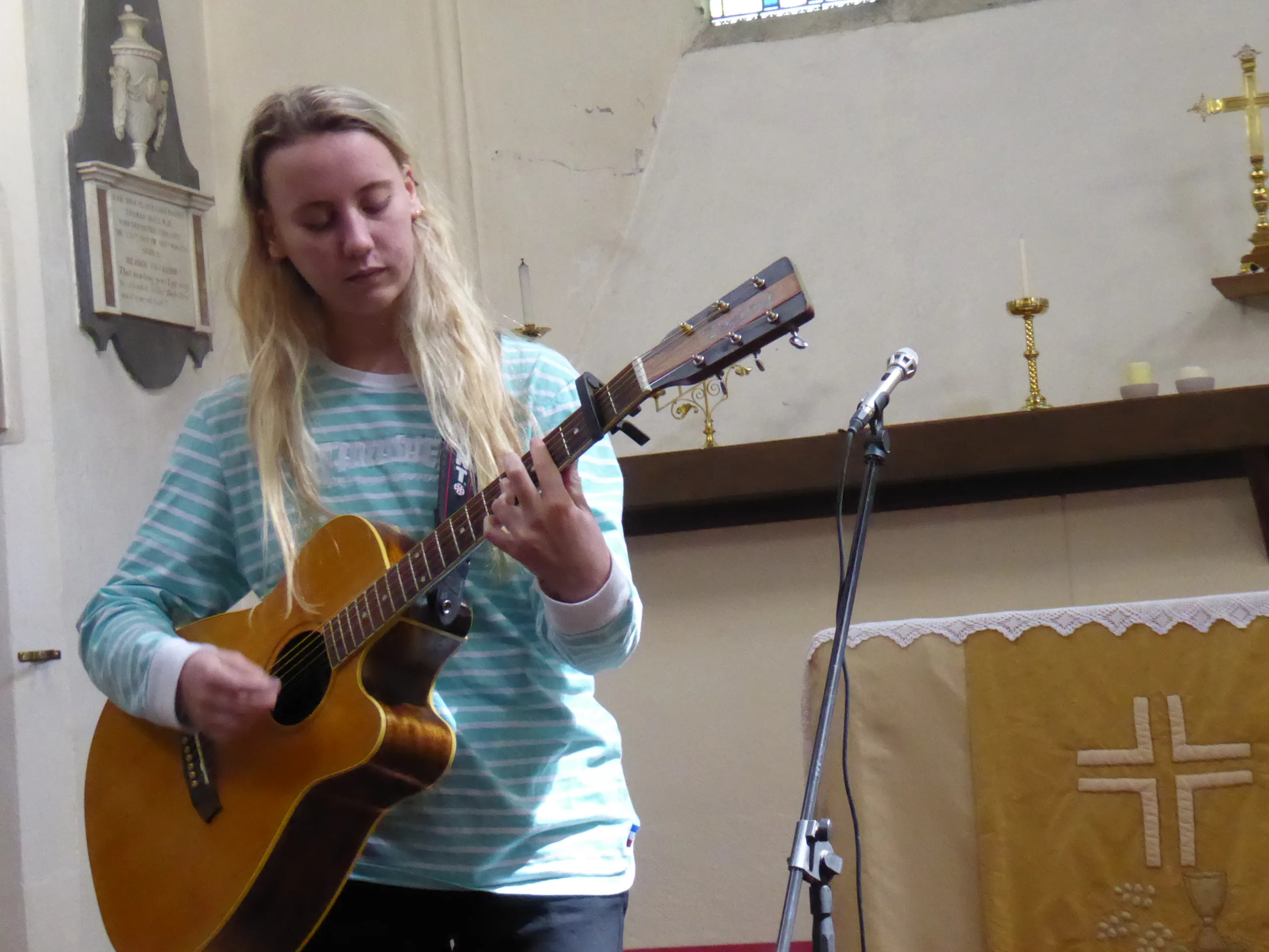 Open the featured image for Emma Chamberlain Internet Hiatus Shows a New Kind of Creator Reset Emma Chamberlain playing guitar during a live performance at Lostfest in 2017