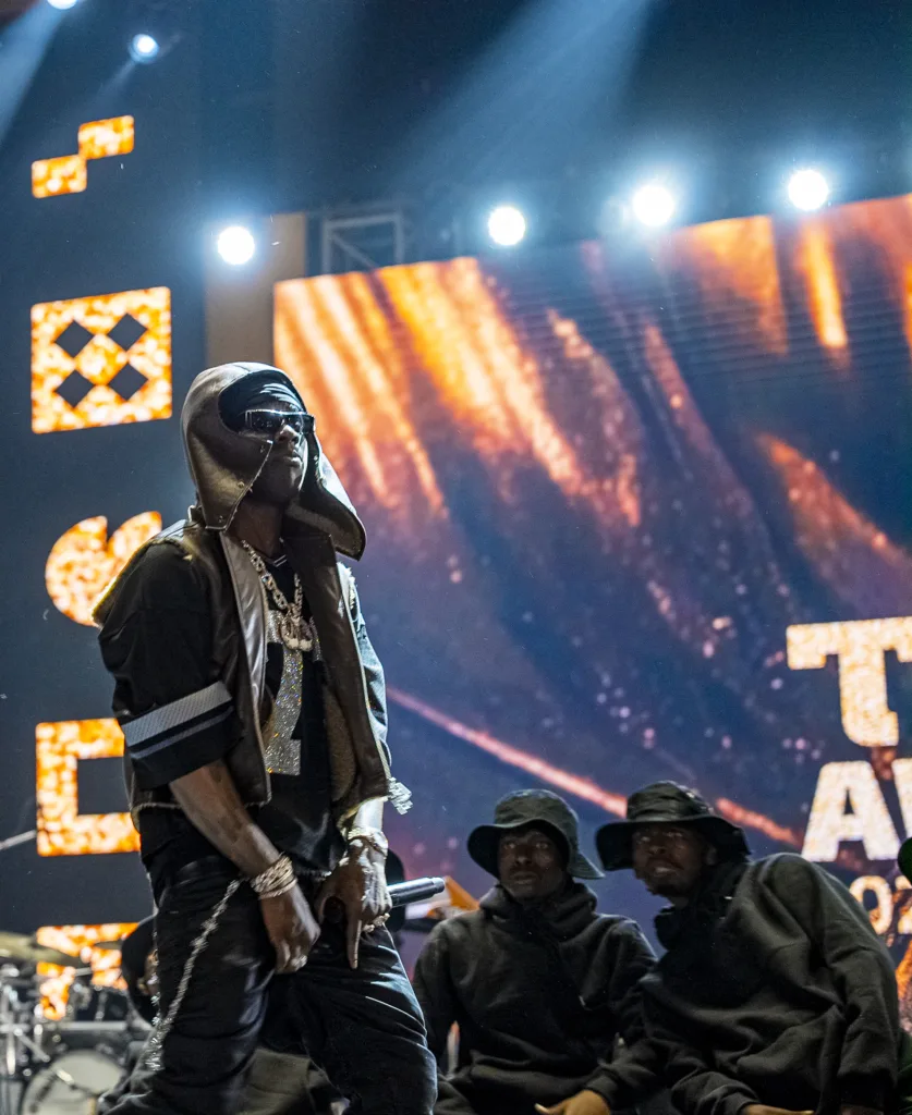 Rema performing live on stage