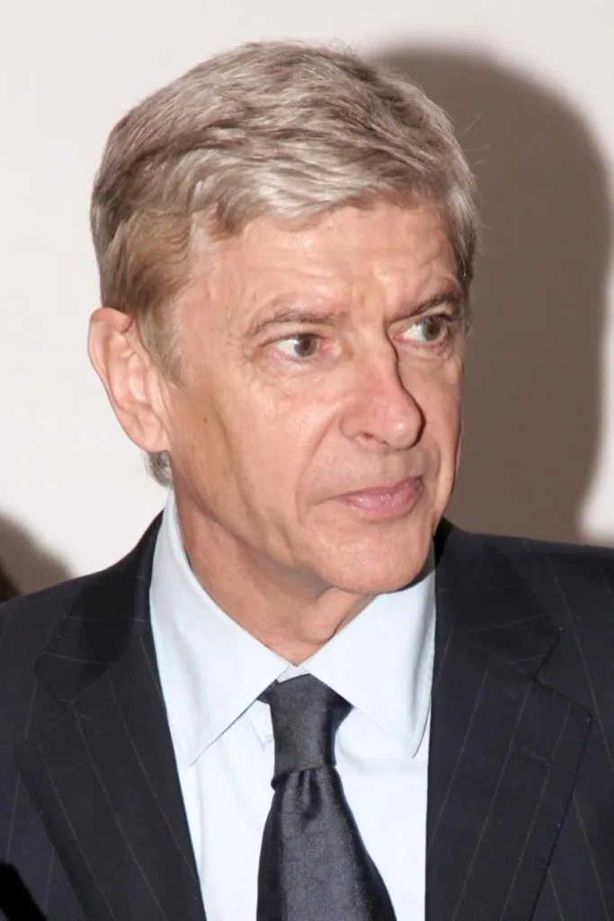 Arsène Wenger in a suit at a London College of Communication event in 2012