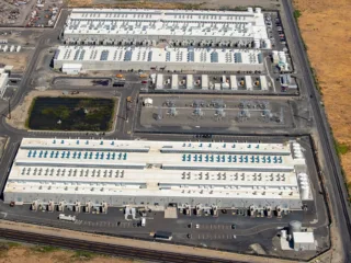 Aerial view of AWS data-centre buildings and electrical infrastructure in Oregon in 2023