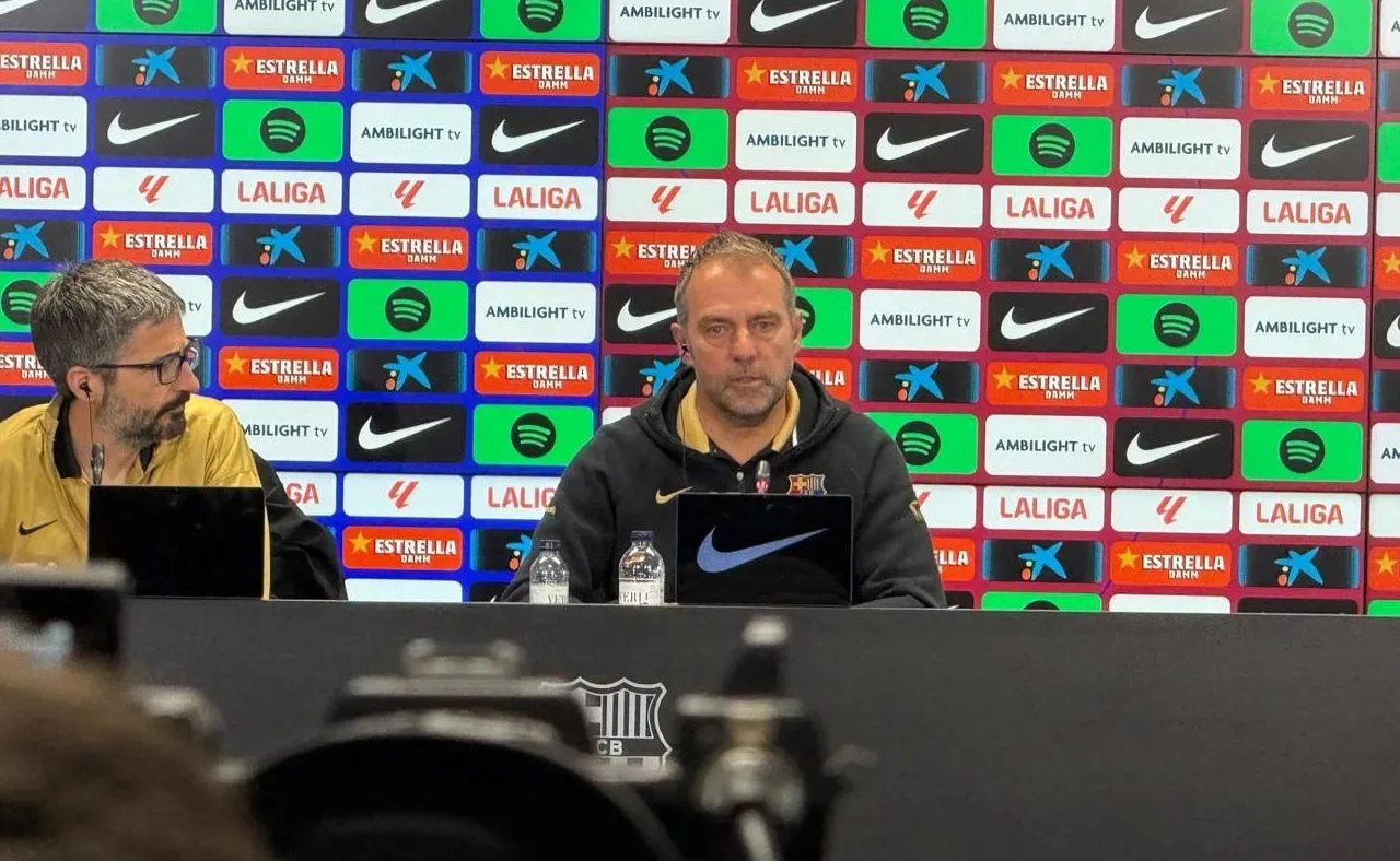 Hansi Flick speaking at a Barcelona press conference in April 2025