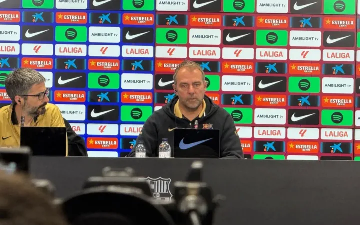 Hansi Flick speaking at a Barcelona press conference in April 2025