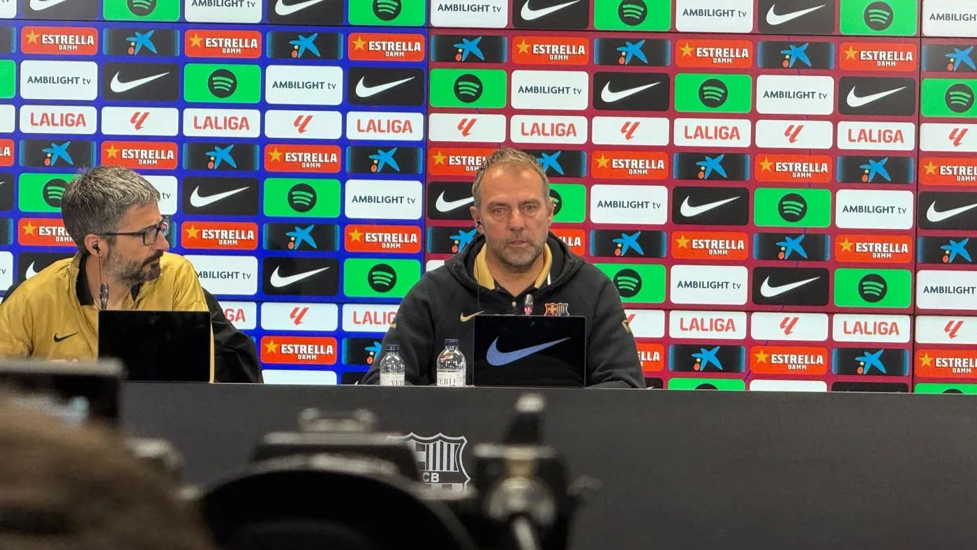 Open the featured image for Barcelona Clasico New Faces: Adeyemi and Espart Await Madrid Hansi Flick speaking at a Barcelona press conference in April 2025