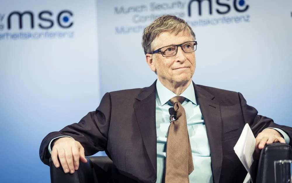 Bill Gates seated onstage at the 2017 Munich Security Conference