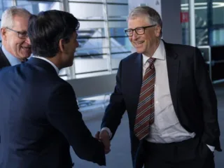 Bill Gates, right, shaking hands with Rishi Sunak at Imperial College London in February 2023