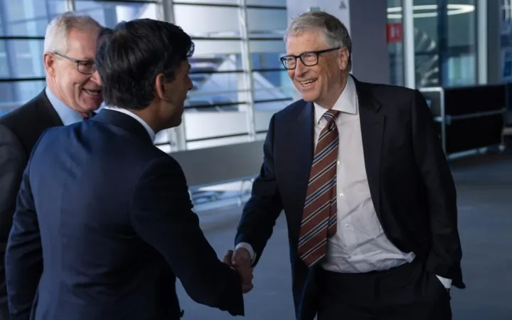 Bill Gates, right, shaking hands with Rishi Sunak at Imperial College London in February 2023