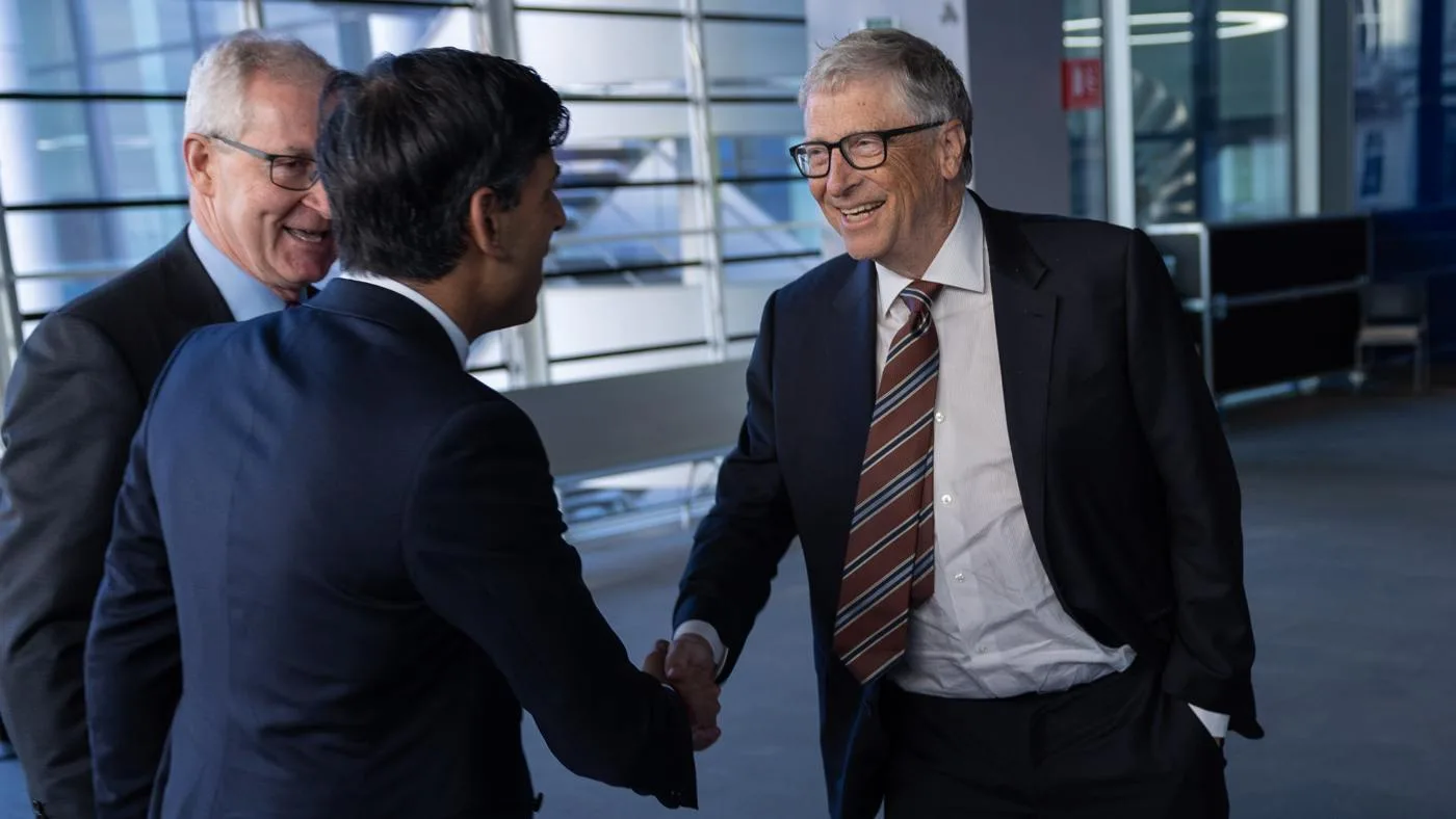 Bill Gates, right, shaking hands with Rishi Sunak at Imperial College London in February 2023