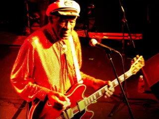 Chuck Berry playing guitar at the Steinegg Live Festival in Italy in October 2013