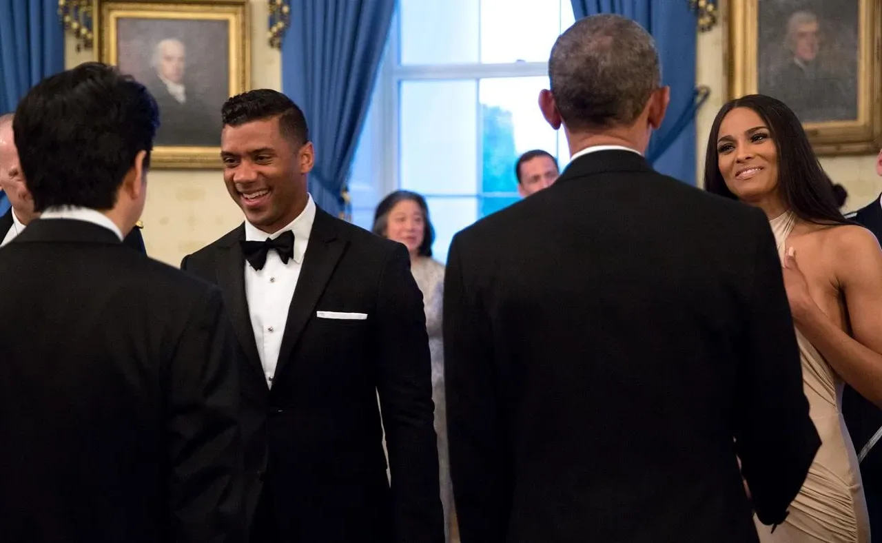 Russell Wilson at left and Ciara at right greet officials at the White House in April 2015