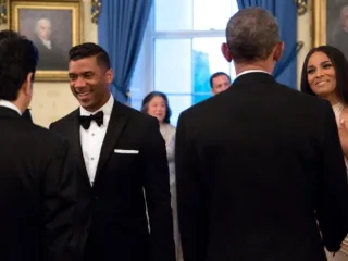 Russell Wilson at left and Ciara at right greet officials at the White House in April 2015