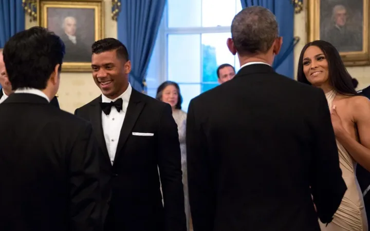 Russell Wilson at left and Ciara at right greet officials at the White House in April 2015