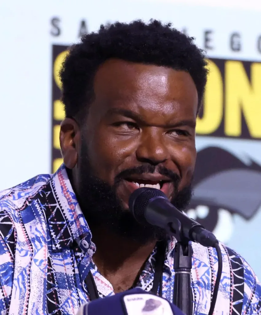 Craig Robinson speaks into a microphone at San Diego Comic-Con in July 2025.