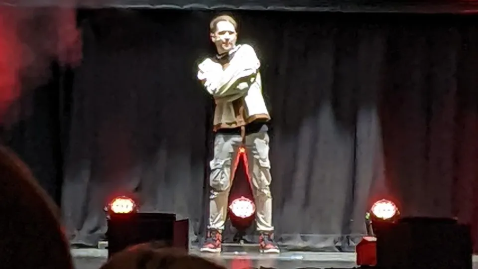 DanTDM performing on stage at the TommyInnit and Friends show in Brighton in 2022