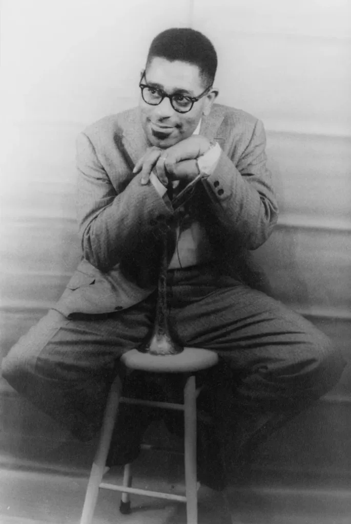 Dizzy Gillespie seated with glasses in Carl Van Vechten’s 1955 archive portrait