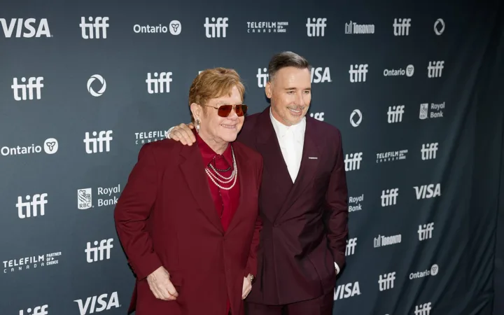 Elton John on the left beside David Furnish at the 2024 Toronto International Film Festival