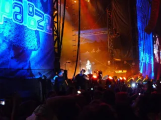Eminem performing with his band on the Lollapalooza stage in 2011