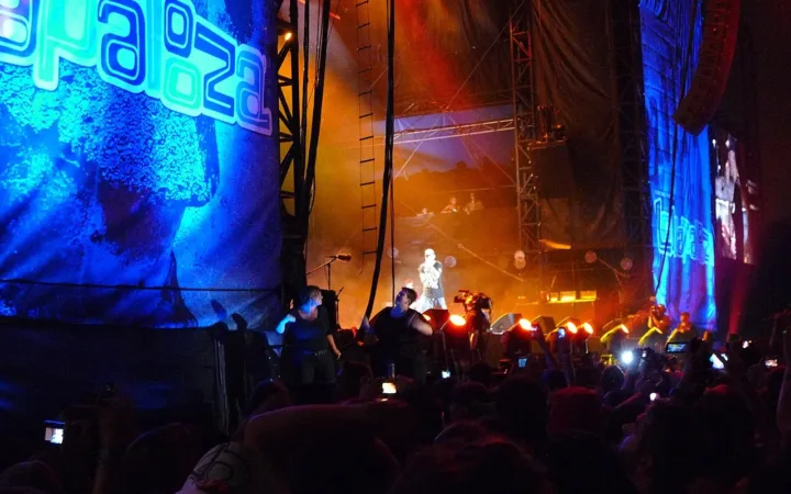 Eminem performing with his band on the Lollapalooza stage in 2011