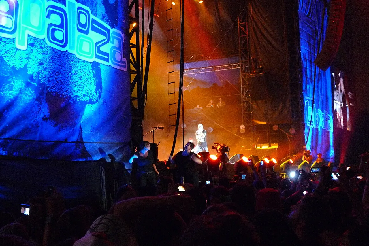 Eminem performing with his band on the Lollapalooza stage in 2011