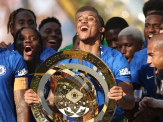 Chelsea players celebrating together after a major 2025 final