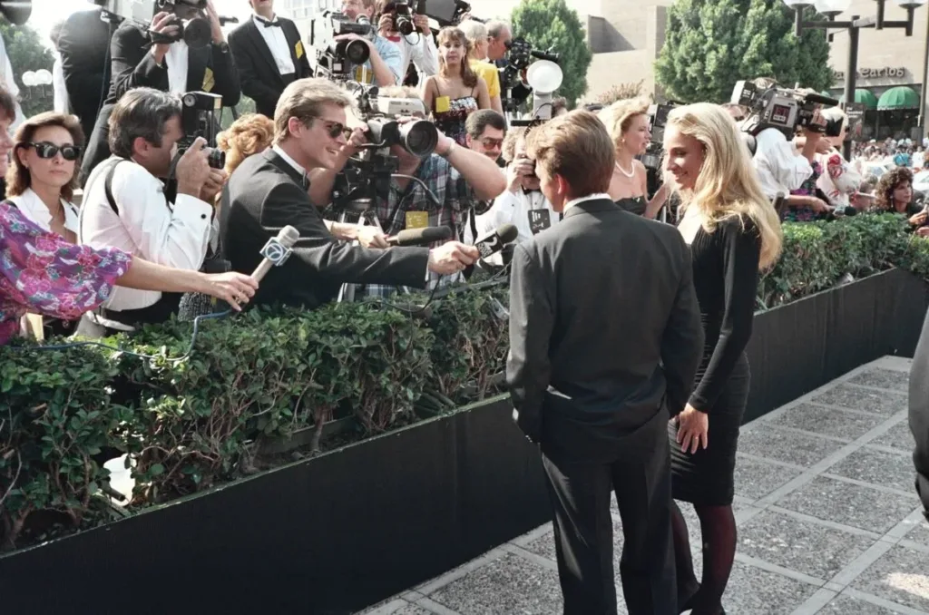 Michael J. Fox and Tracy Pollan facing reporters at the 1988 Emmy Awards