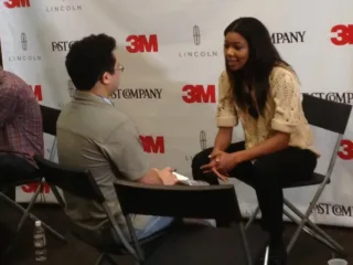 Gabrielle Union talking with an interviewer at the Fast Company Grill in 2012