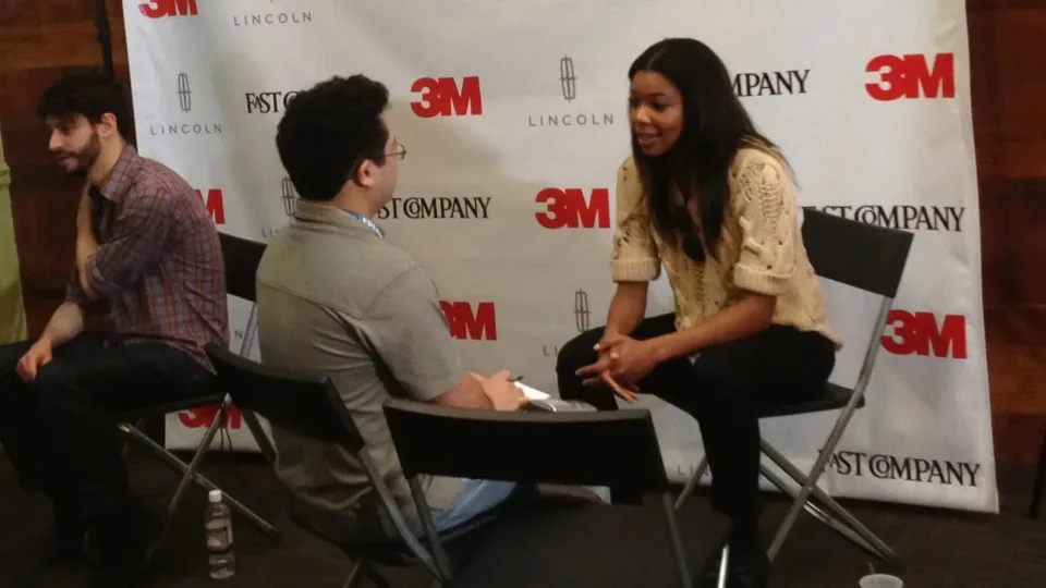 Gabrielle Union talking with an interviewer at the Fast Company Grill in 2012