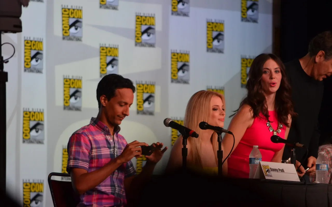 Gillian Jacobs in the centre with Danny Pudi on the left and Alison Brie on the right at a 2012 Comic-Con panel