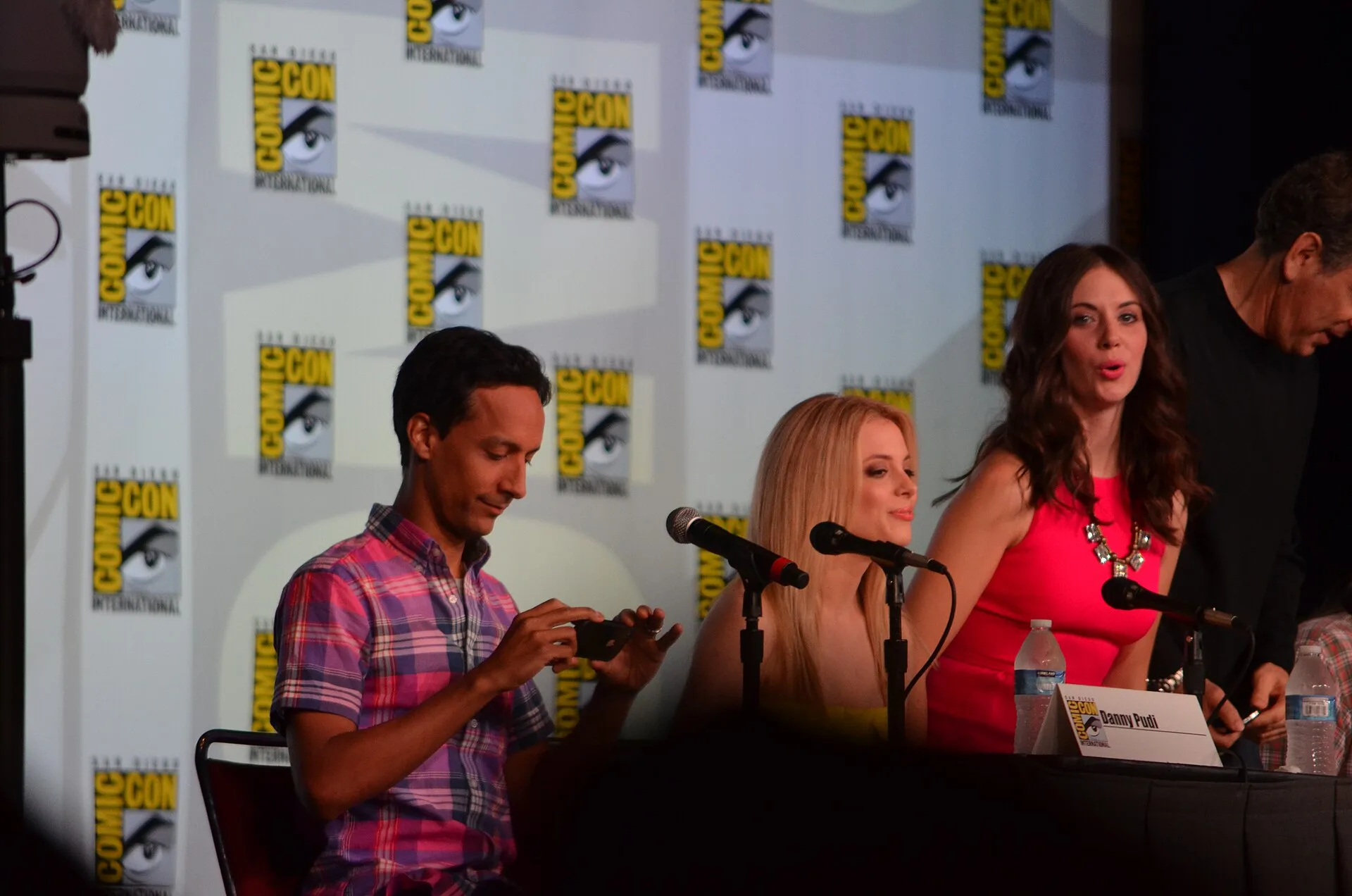 Gillian Jacobs in the centre with Danny Pudi on the left and Alison Brie on the right at a 2012 Comic-Con panel