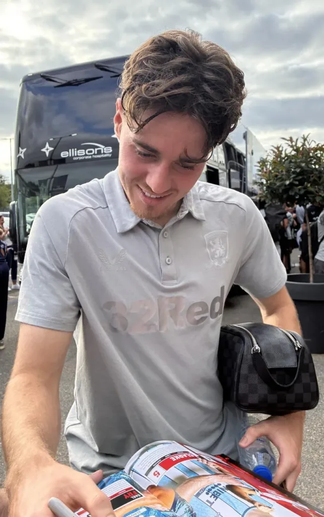 Hayden Hackney signing a programme after a Middlesbrough match in August 2025