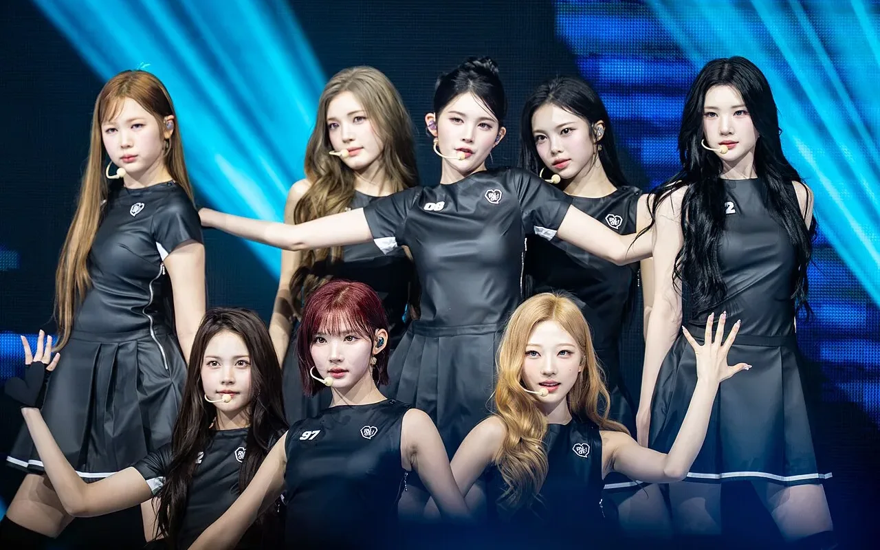 The eight members of Hearts2Hearts pose together onstage at a 2026 fan event.
