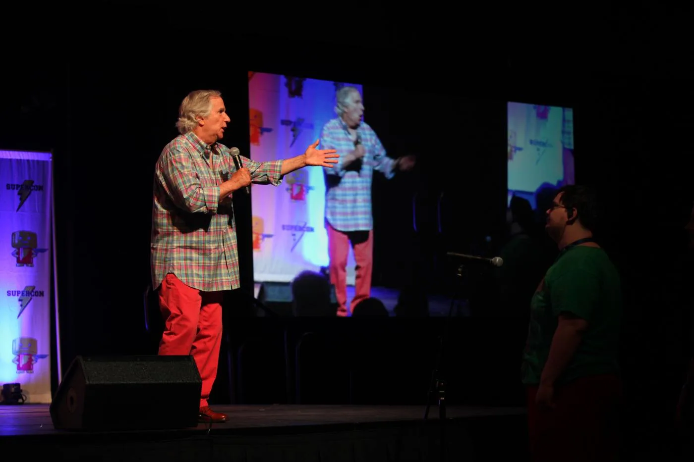 Open the featured image for Henry Winkler and Stacey: Listening Across 48 Years Henry Winkler speaking to an audience at Raleigh Supercon in 2018