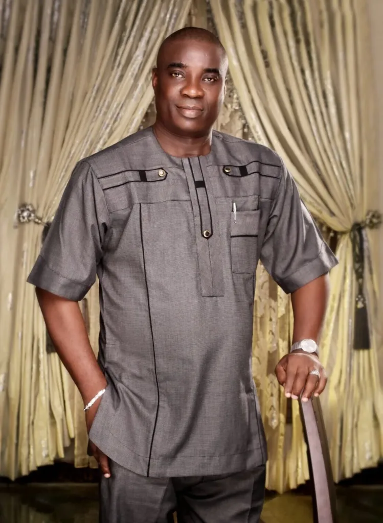 KWAM 1 standing in a grey outfit in an archive portrait