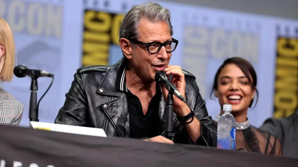 Jeff Goldblum speaking into a microphone on the Thor Ragnarok panel at San Diego Comic-Con in 2017