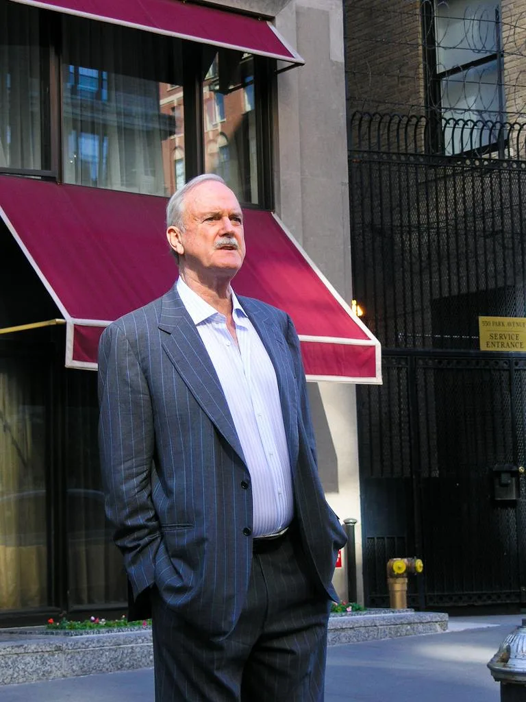 John Cleese standing outside a building in May 2008