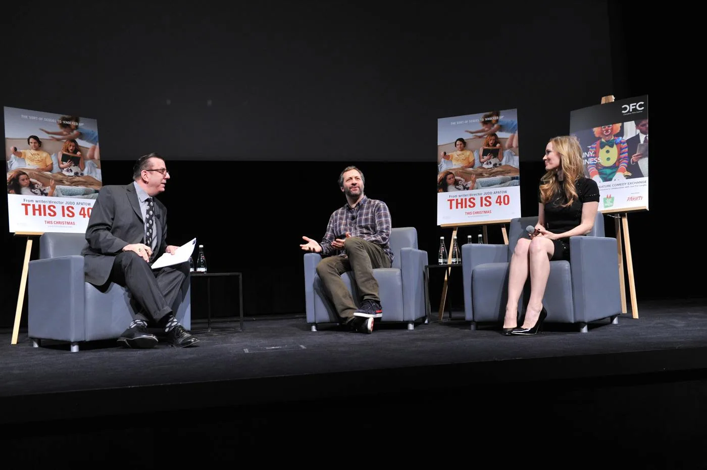 Judd Apatow seated between Richard Crouse and Leslie Mann at a 2012 comedy discussion