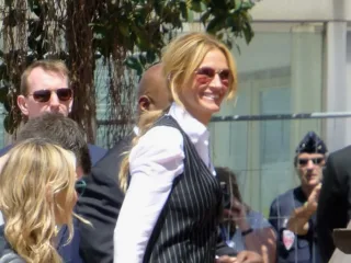 Julia Roberts wearing sunglasses and a striped waistcoat at Cannes in May 2016