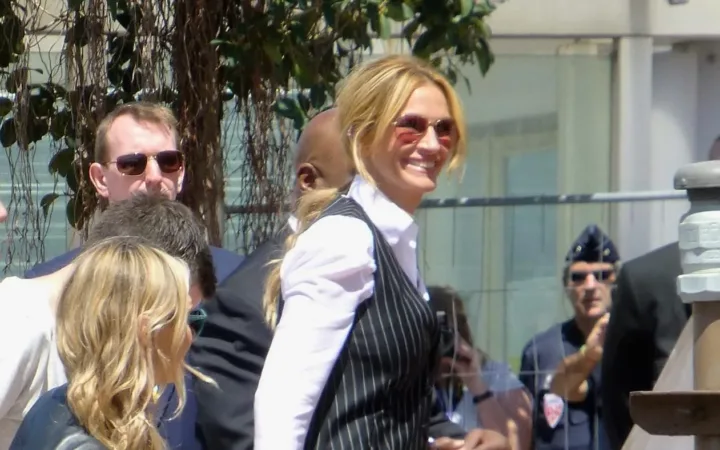 Julia Roberts wearing sunglasses and a striped waistcoat at Cannes in May 2016