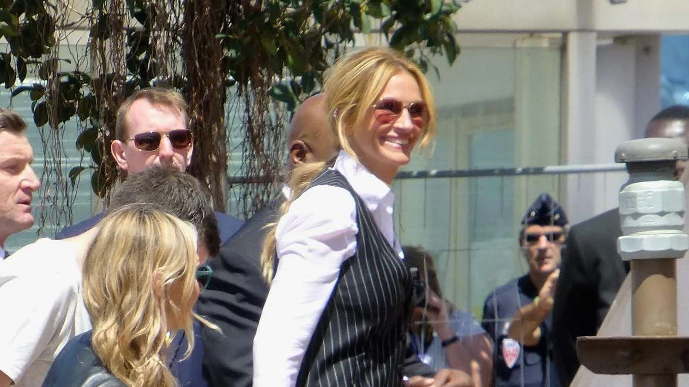 Open the featured image for Julia Roberts and Danny Moder: Marriage and Shared Film Work Julia Roberts wearing sunglasses and a striped waistcoat at Cannes in May 2016
