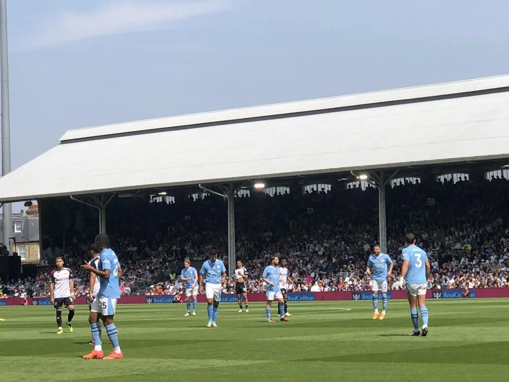 Manchester City players on the pitch at Fulham in May 2024