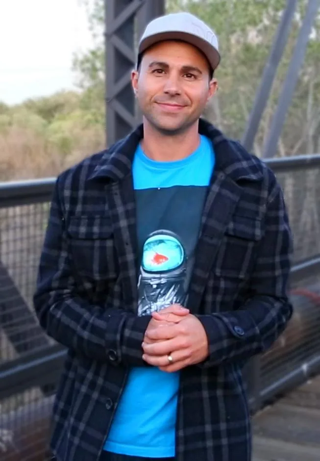 Mark Rober speaking outdoors in a 2016 video still