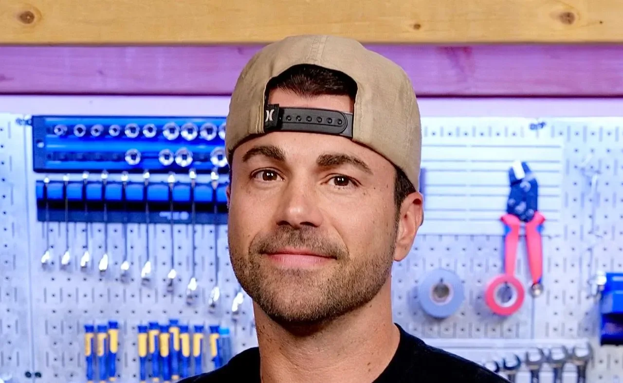 Mark Rober wearing a backwards cap in front of workshop tools, January 2025