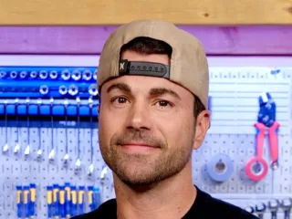 Mark Rober wearing a backwards cap in front of workshop tools, January 2025