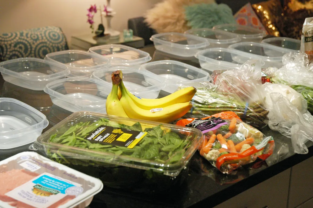 Groceries and empty food containers arranged before meal preparation