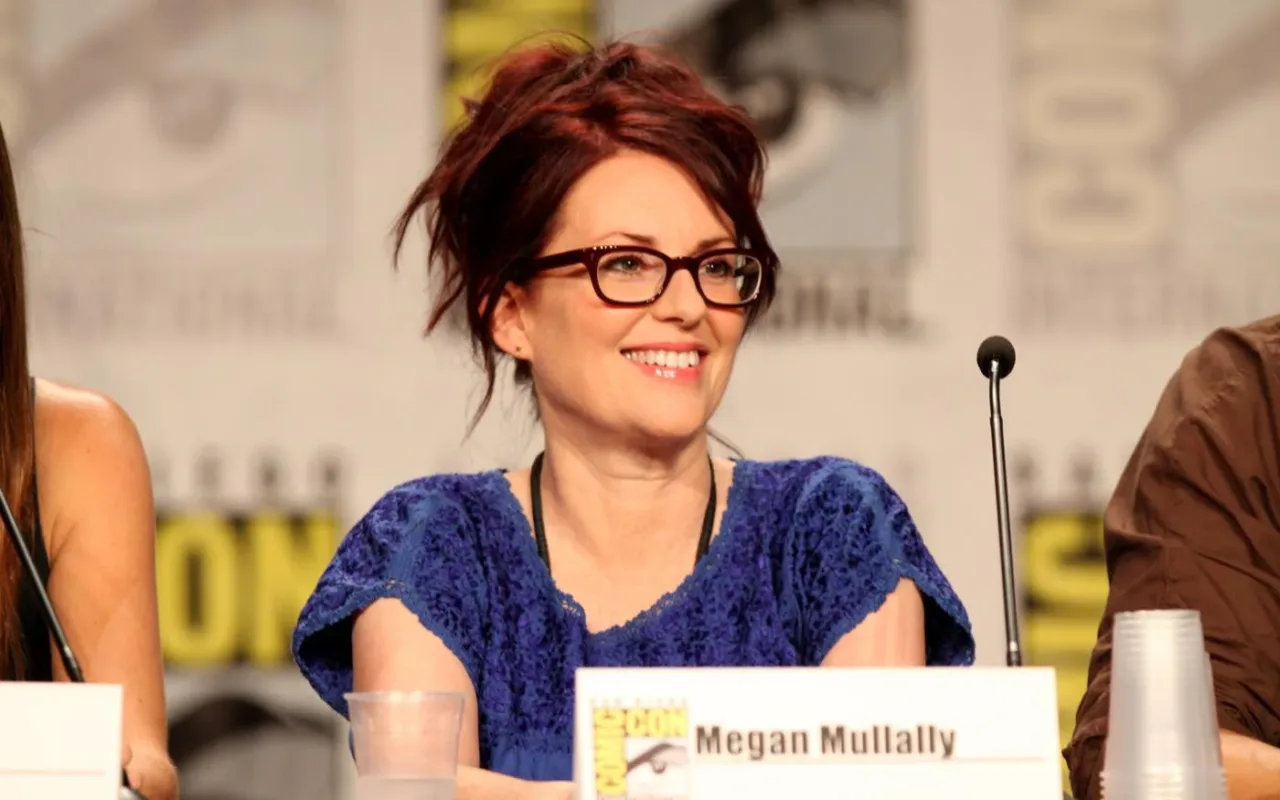 Megan Mullally smiling at a Comic-Con panel in San Diego in July 2011