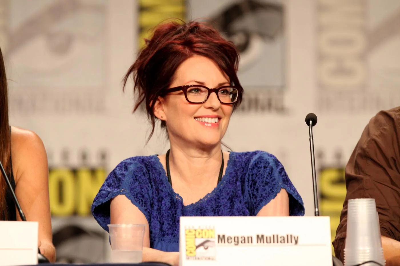 Open the featured image for Megan Mullally and Nick Offerman: From Theatre to Shared Stories Megan Mullally smiling at a Comic-Con panel in San Diego in July 2011