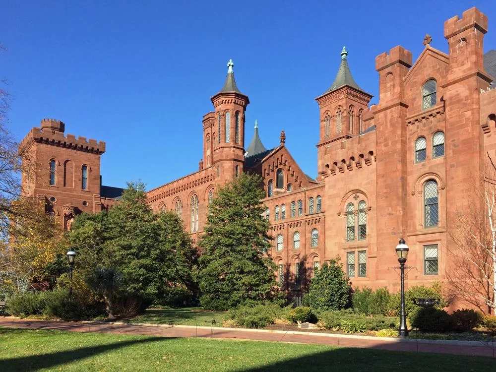 Red sandstone towers of the Smithsonian Castle viewed from the Haupt Garden in 2016