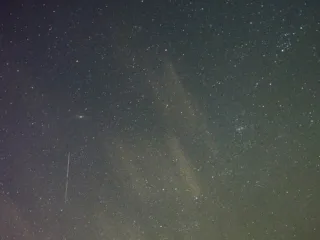A bright Orionid meteor streak across a star-filled sky in an archive photograph from October 2020
