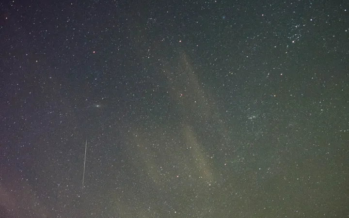 A bright Orionid meteor streak across a star-filled sky in an archive photograph from October 2020